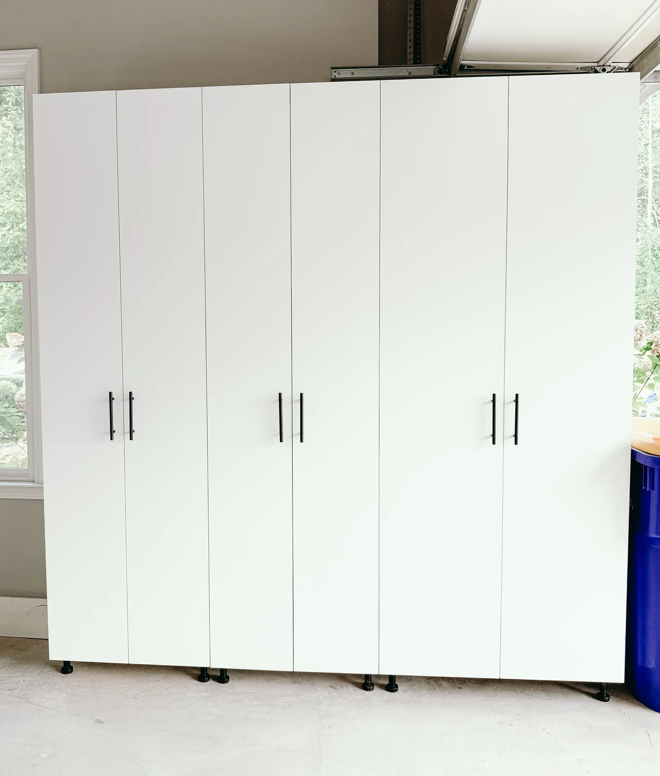 Full-Wall White Garage Cabinet System — finished view 1