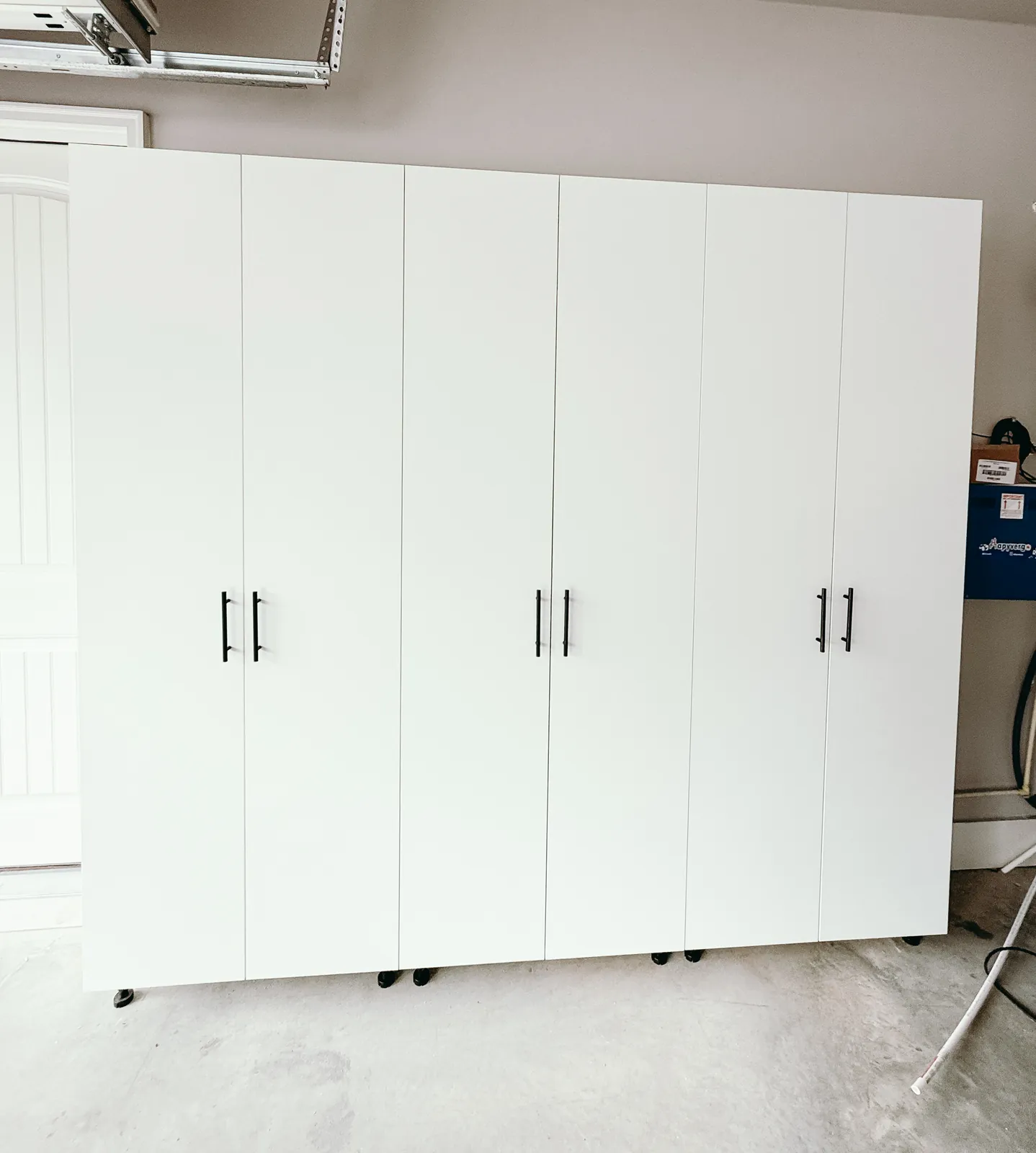 Full-Wall White Garage Cabinet System — finished view 2