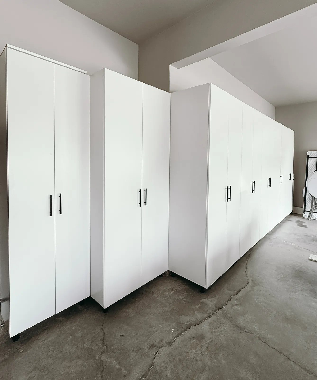 Full-Wall White Garage Cabinet System — finished view 4