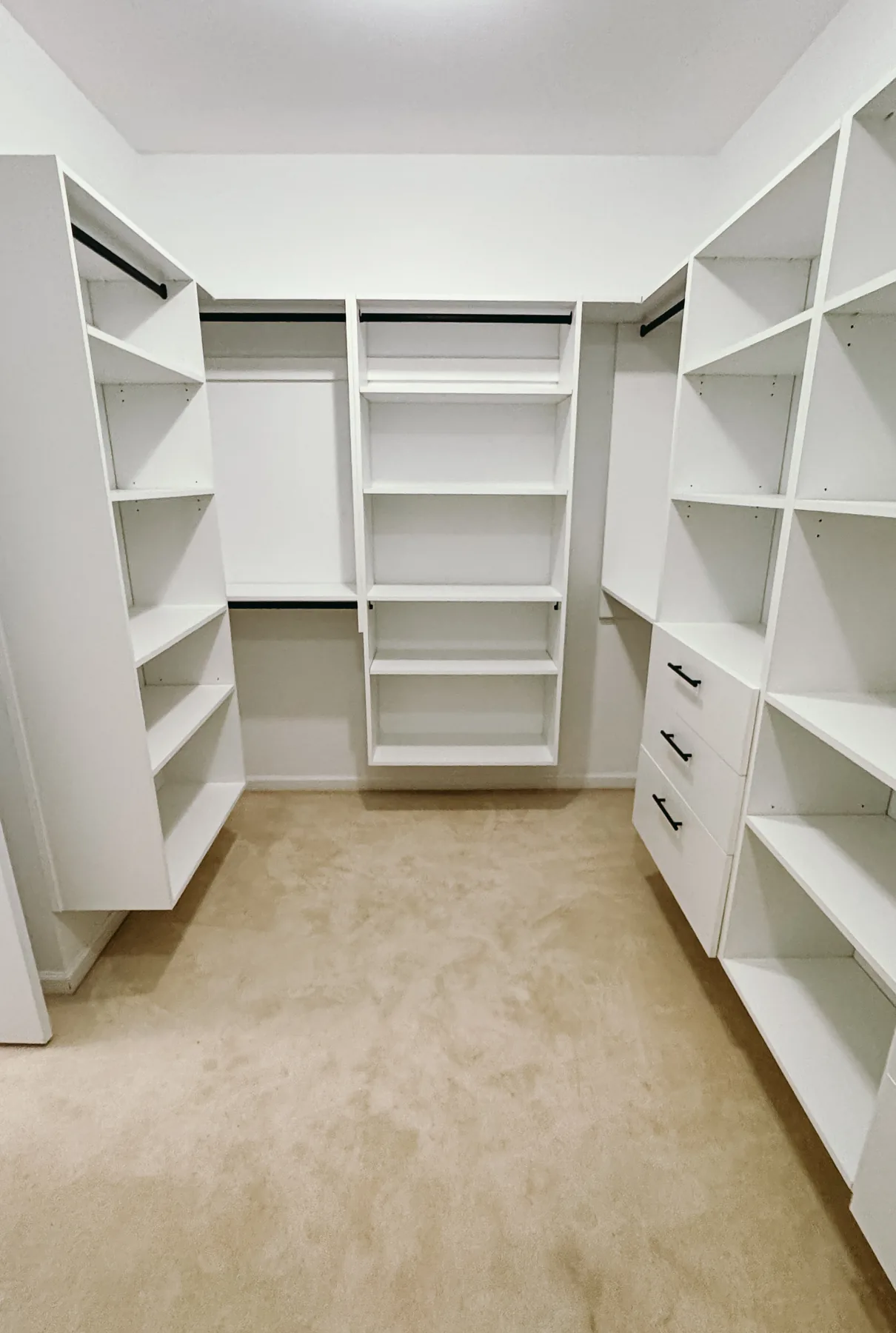 Open White Walk-In Closet with Dual Drawer Towers — finished view 1