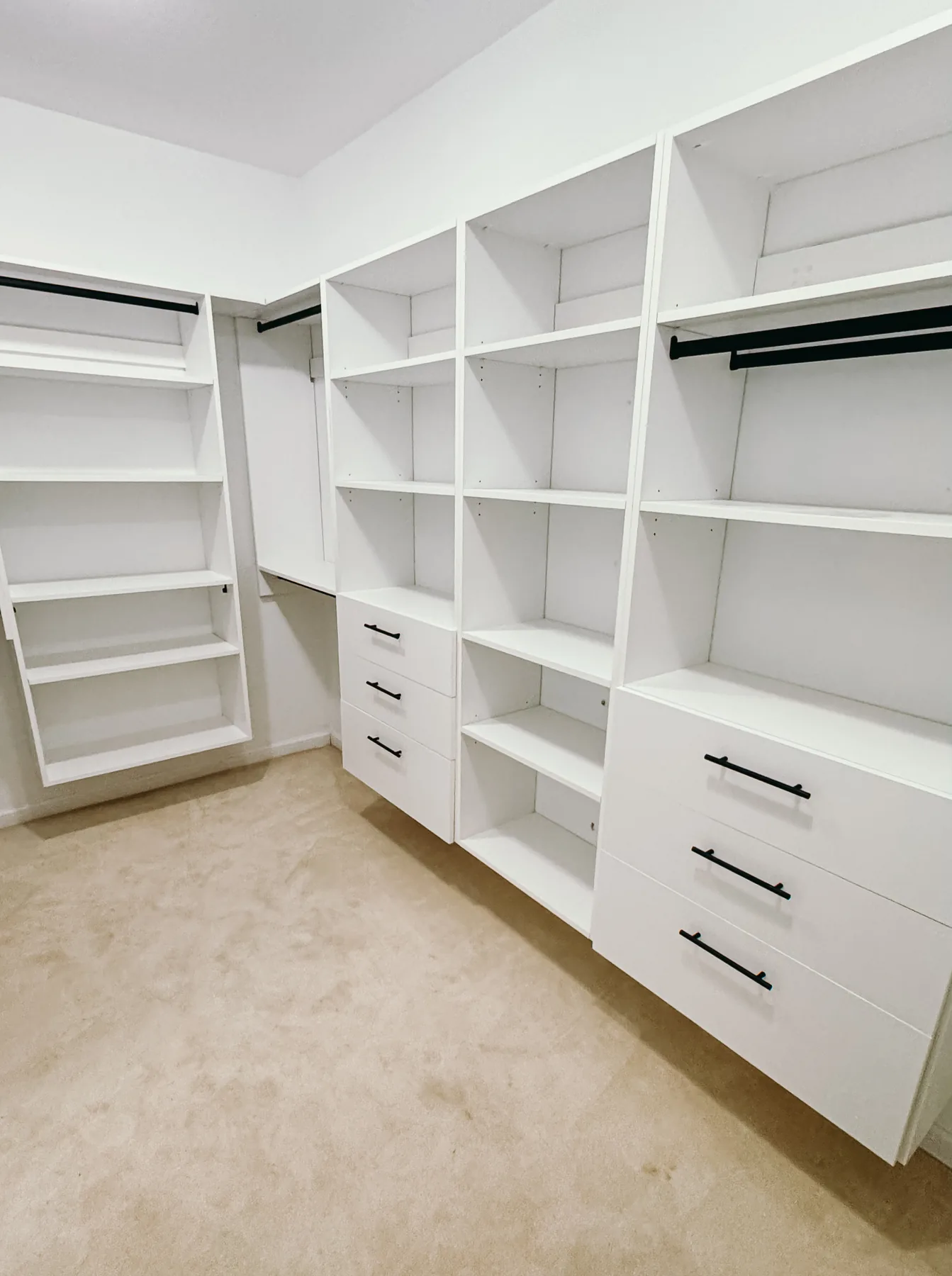Open White Walk-In Closet with Dual Drawer Towers — finished view 4