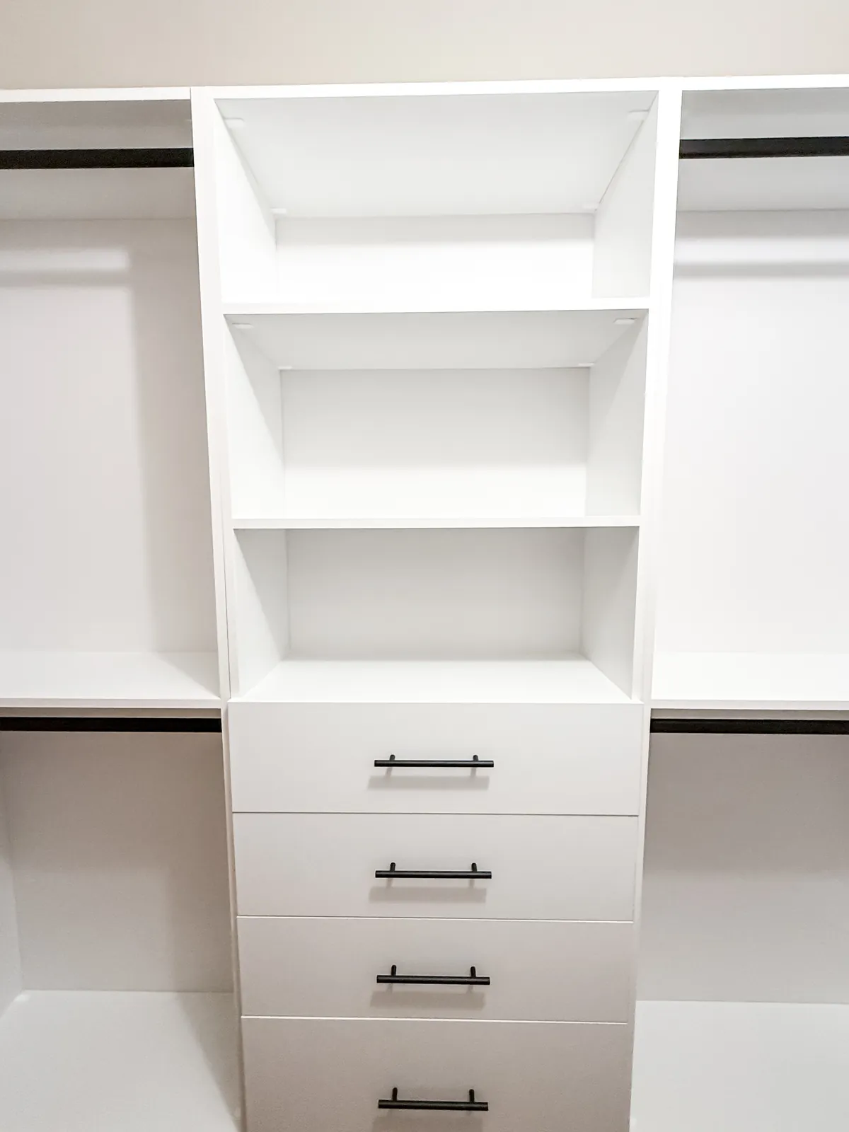 White Reach-In Closet with Black Hardware — finished view 1