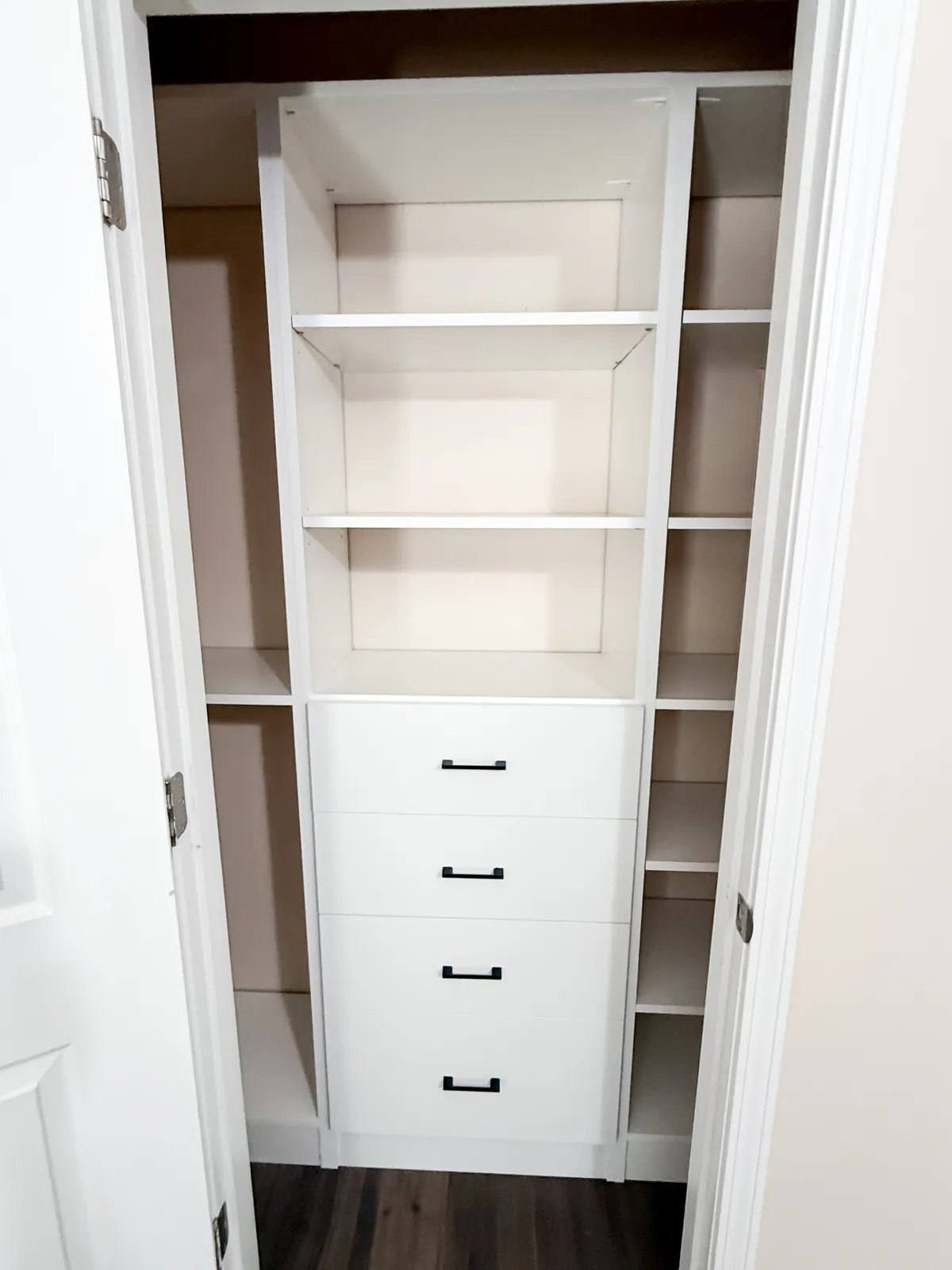 White Reach-In Closet with Black Hardware — finished view 2