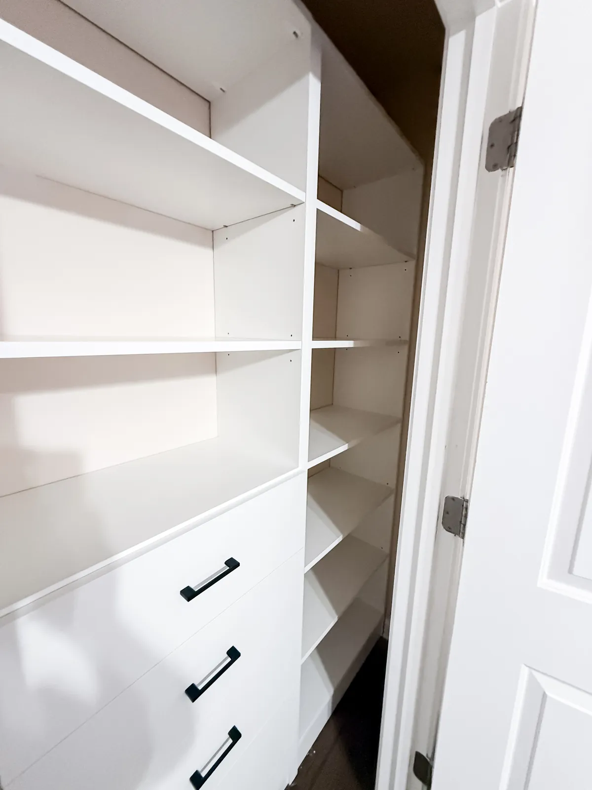White Reach-In Closet with Black Hardware — finished view 3