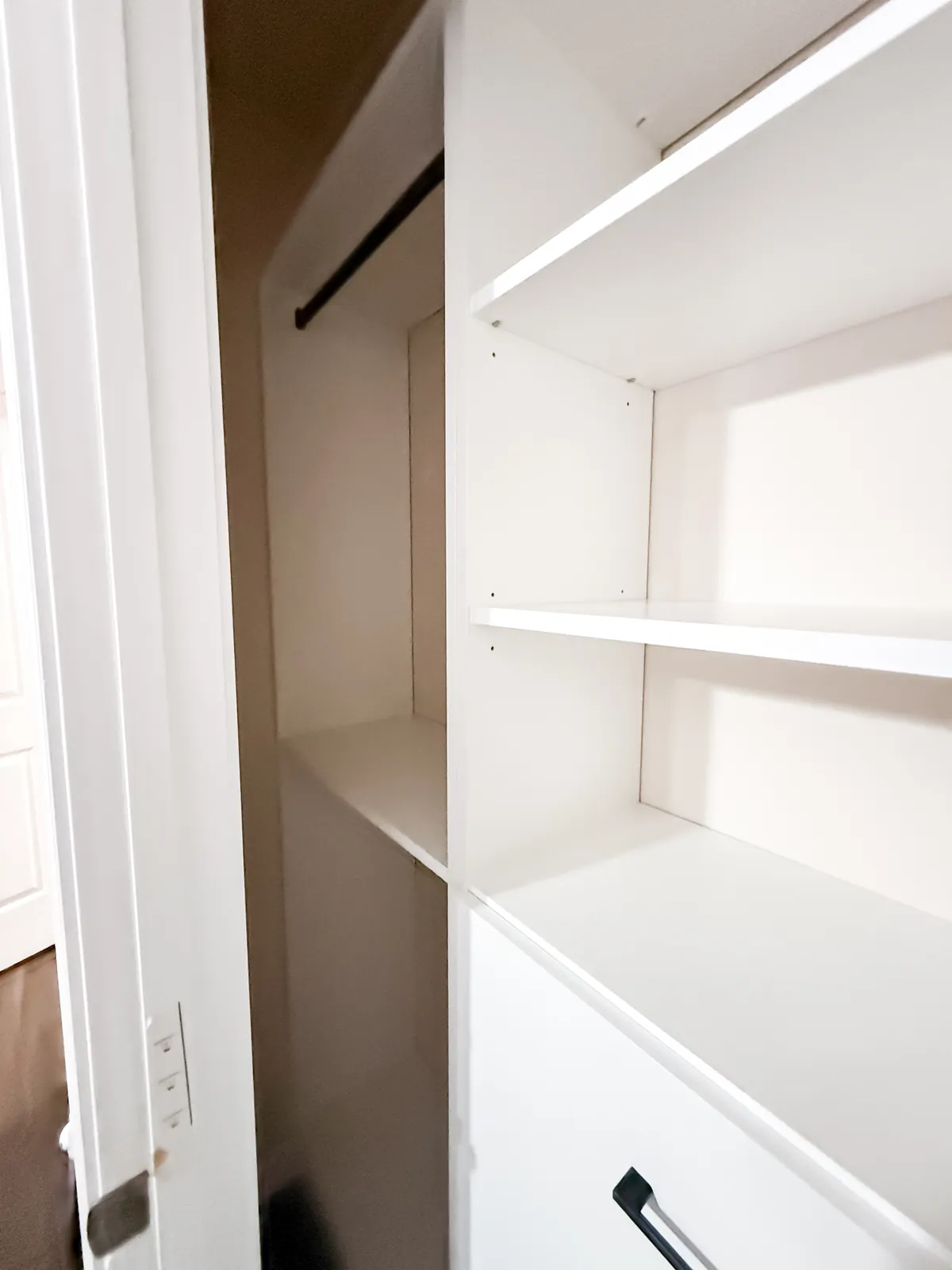 White Reach-In Closet with Black Hardware — finished view 4